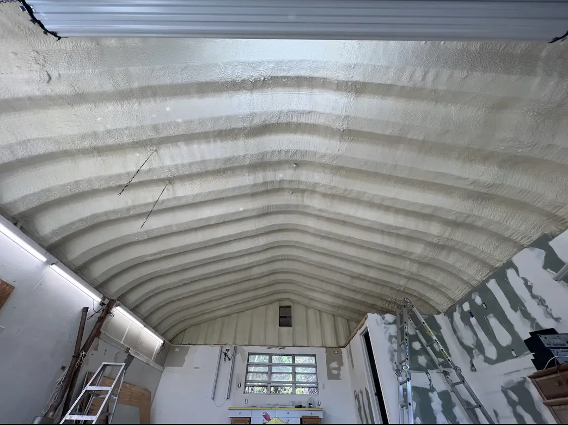 Spray polyurethane foam applied to the underside of a metal roof deck in Fort Washington